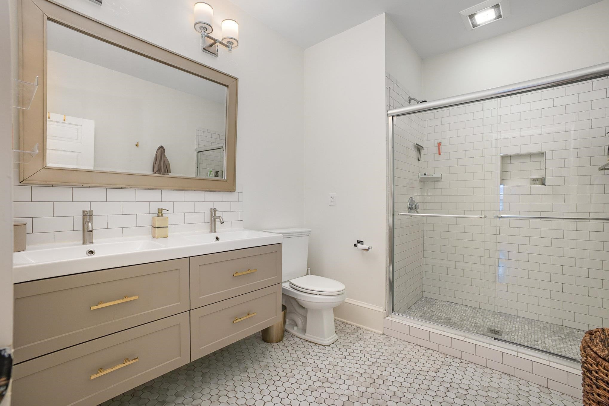 908 Burch Avenue Durham, NC 27701 - Photo 15 of 27 a bathroom with a toilet sink and shower