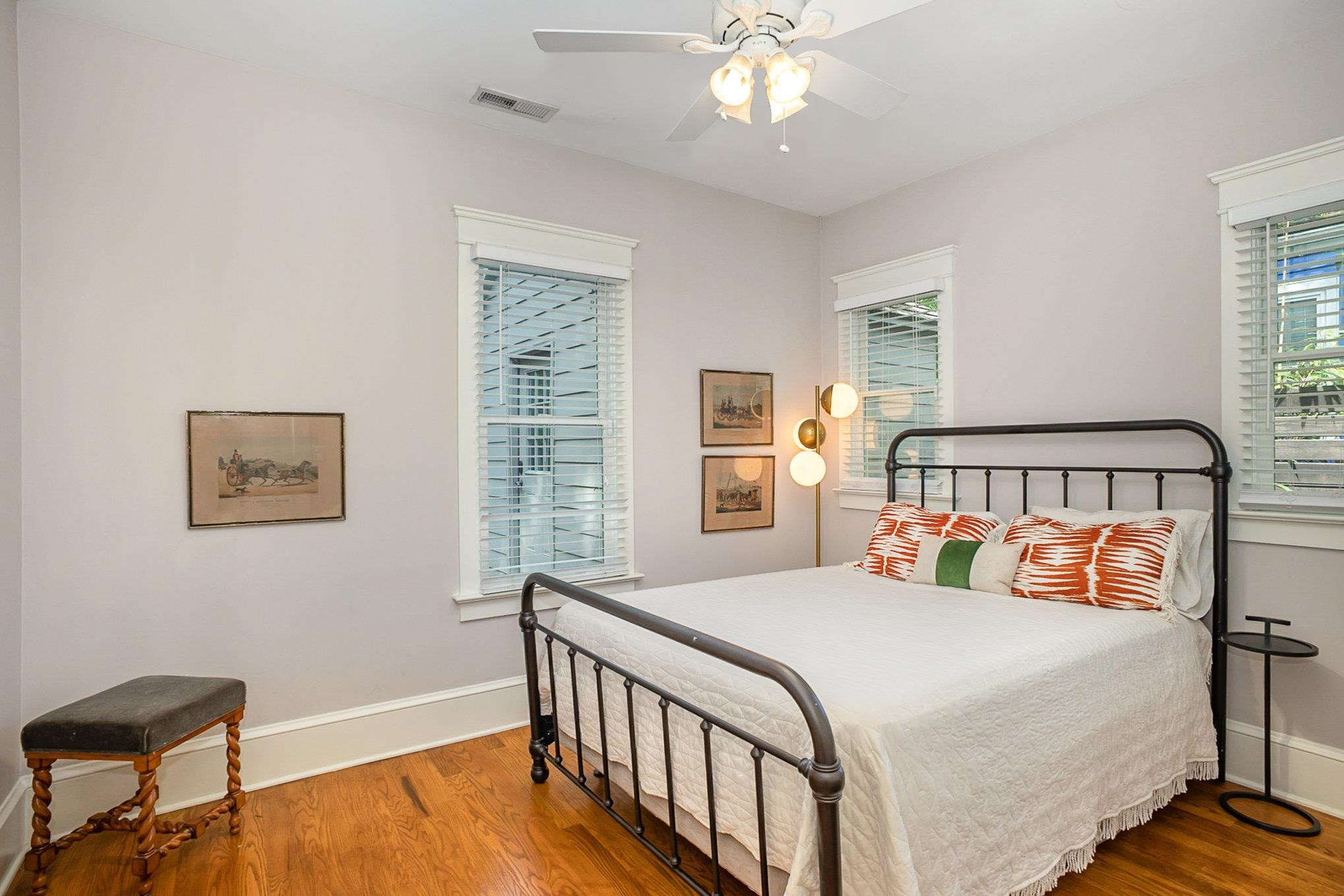 908 Burch Avenue Durham, NC 27701 - Photo 18 of 27 a bedroom with a bed and a chandelier