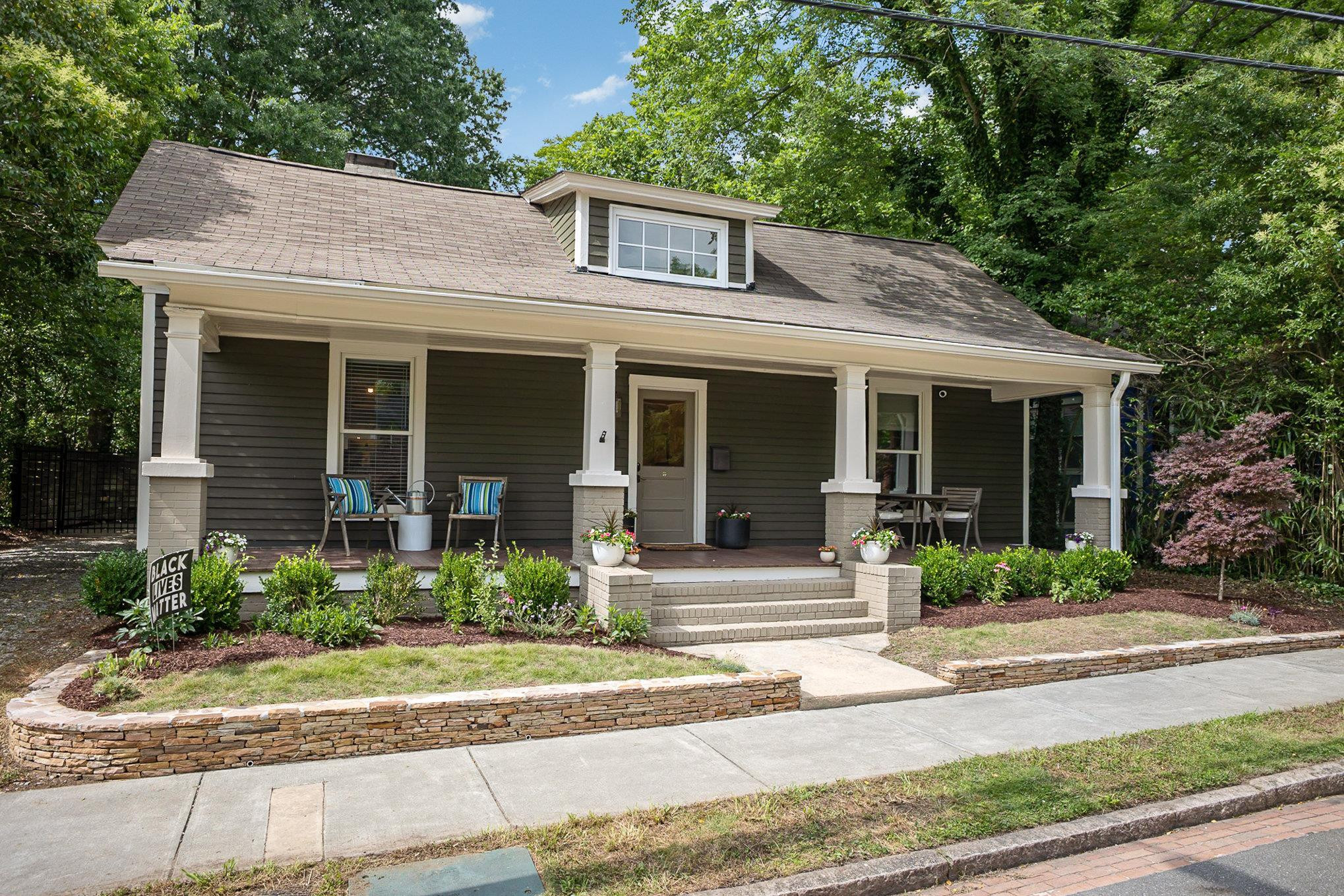 908 Burch Avenue Durham, NC 27701 - Photo 2 of 27 a front view of a house with garden and porch