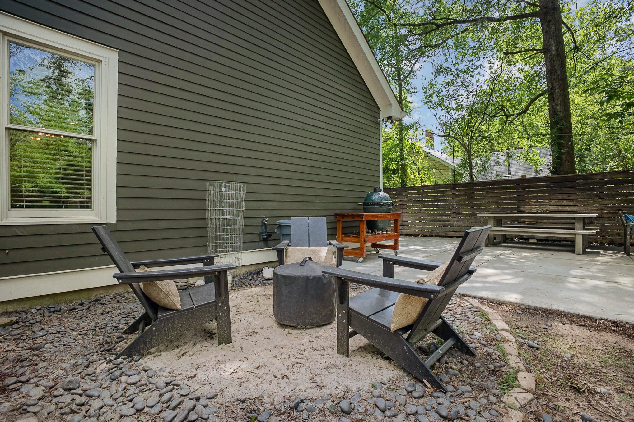 908 Burch Avenue Durham, NC 27701 - Photo 24 of 27 a view of a lounge chair and table in the backyard