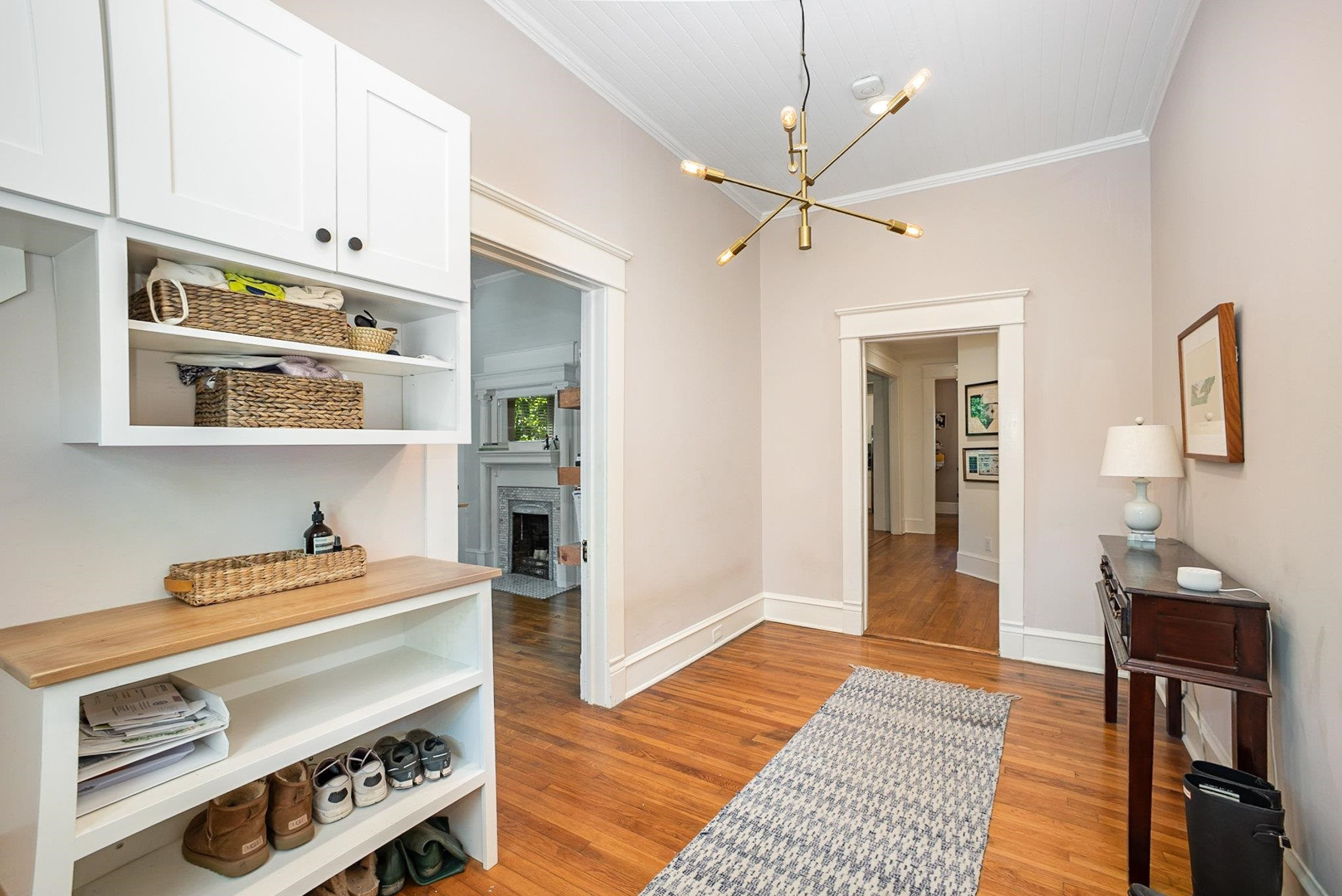 908 Burch Avenue Durham, NC 27701 - Photo 5 of 27 a bedroom with furniture and a chandelier
