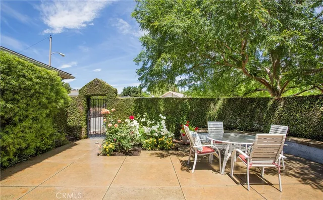 a view of a chairs and table in the patio
