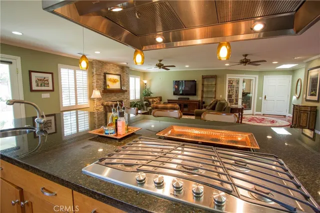 a large room with lots of tables a chandelier and living room view