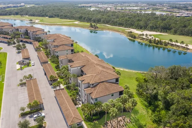 a very nice looking living room with furniture and floor to ceiling windows