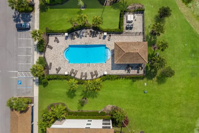 a living room with fireplace furniture and a potted plant