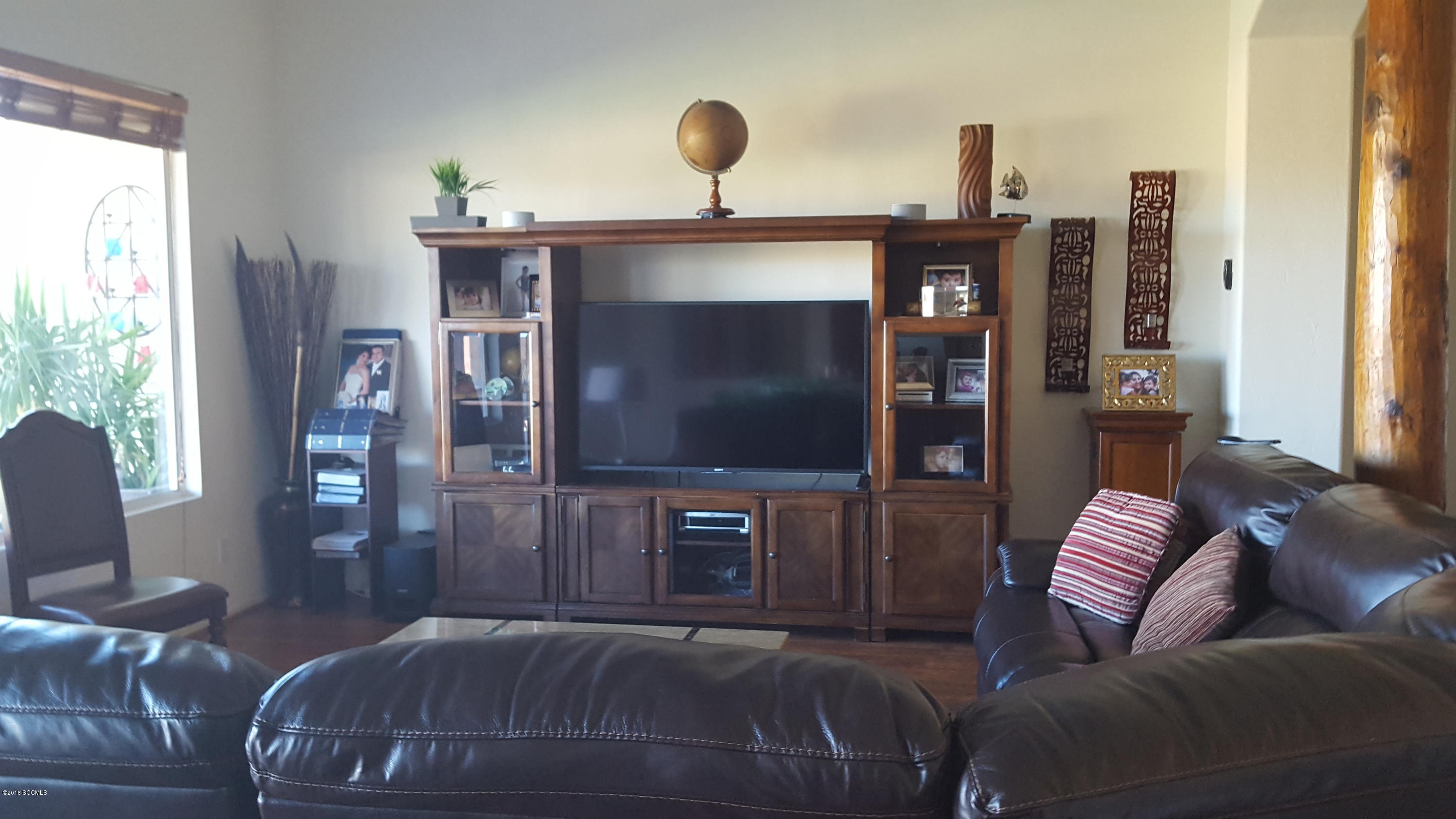 304 Circulo Bellagio Rio Rico, AZ 85648 - Photo 6 of 19 a living room with furniture and a flat screen tv