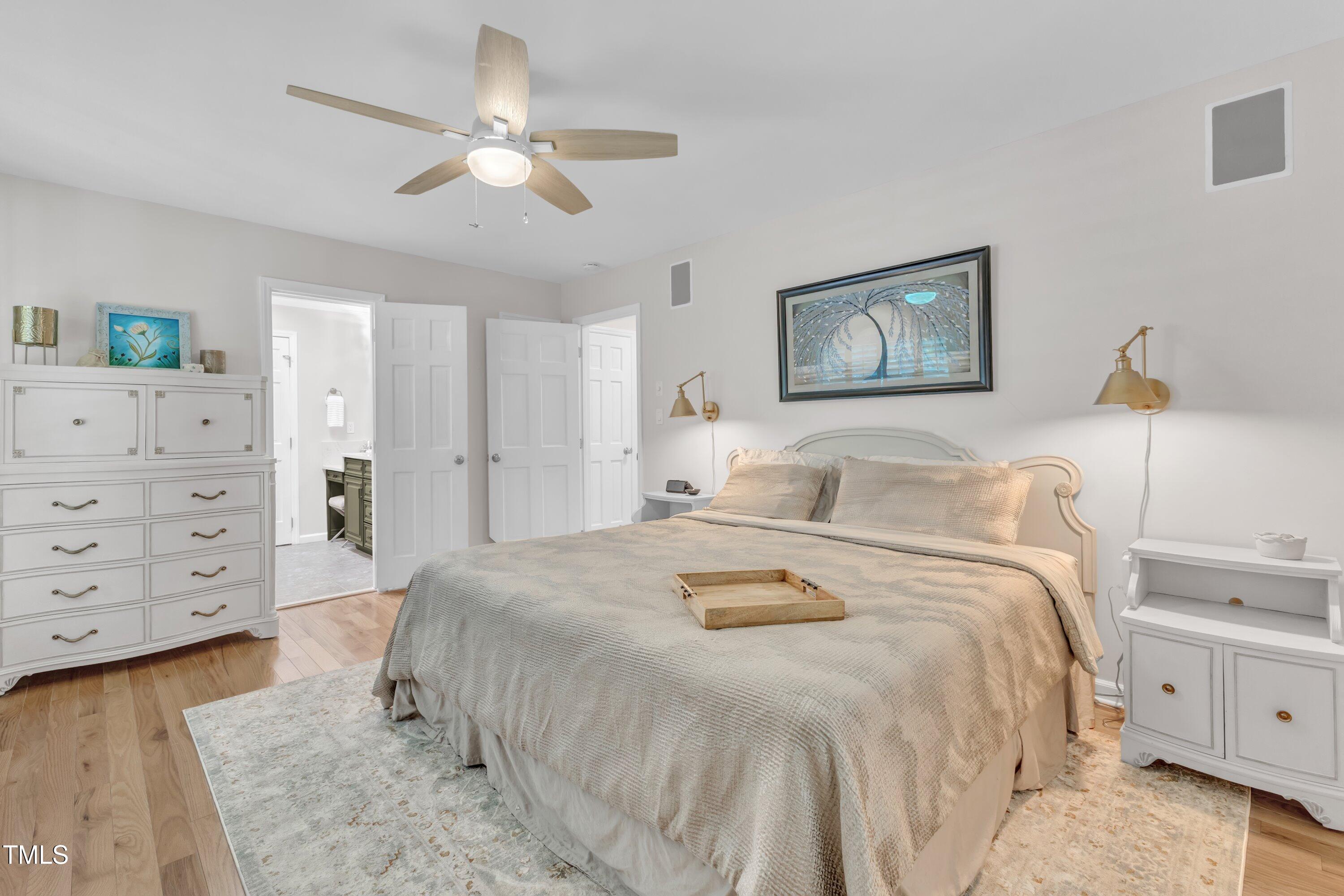 11100 Honeycutt Road Raleigh, NC 27614 - Photo 15 of 37 a spacious bedroom with a bed and a cabinets