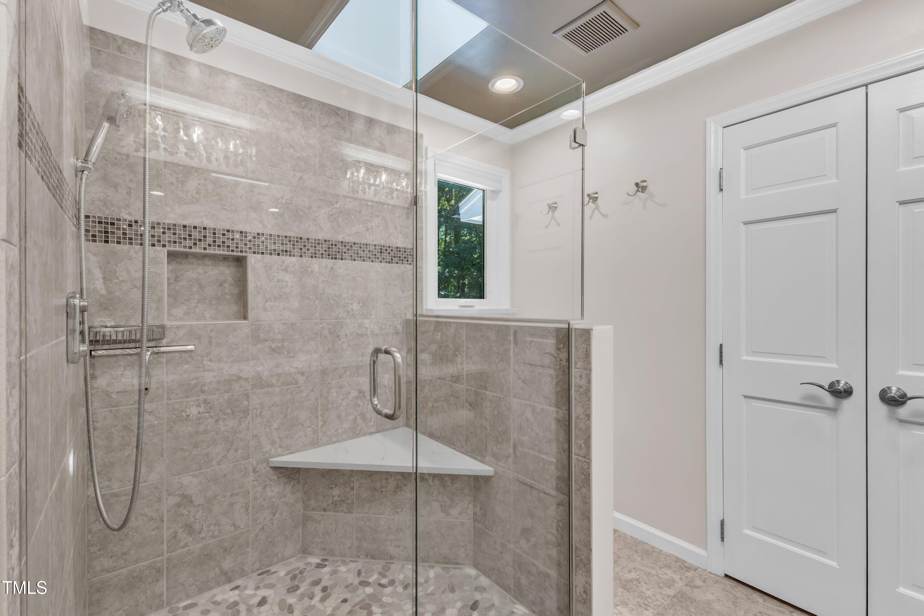 11100 Honeycutt Road Raleigh, NC 27614 - Photo 17 of 37 a bathroom with a shower