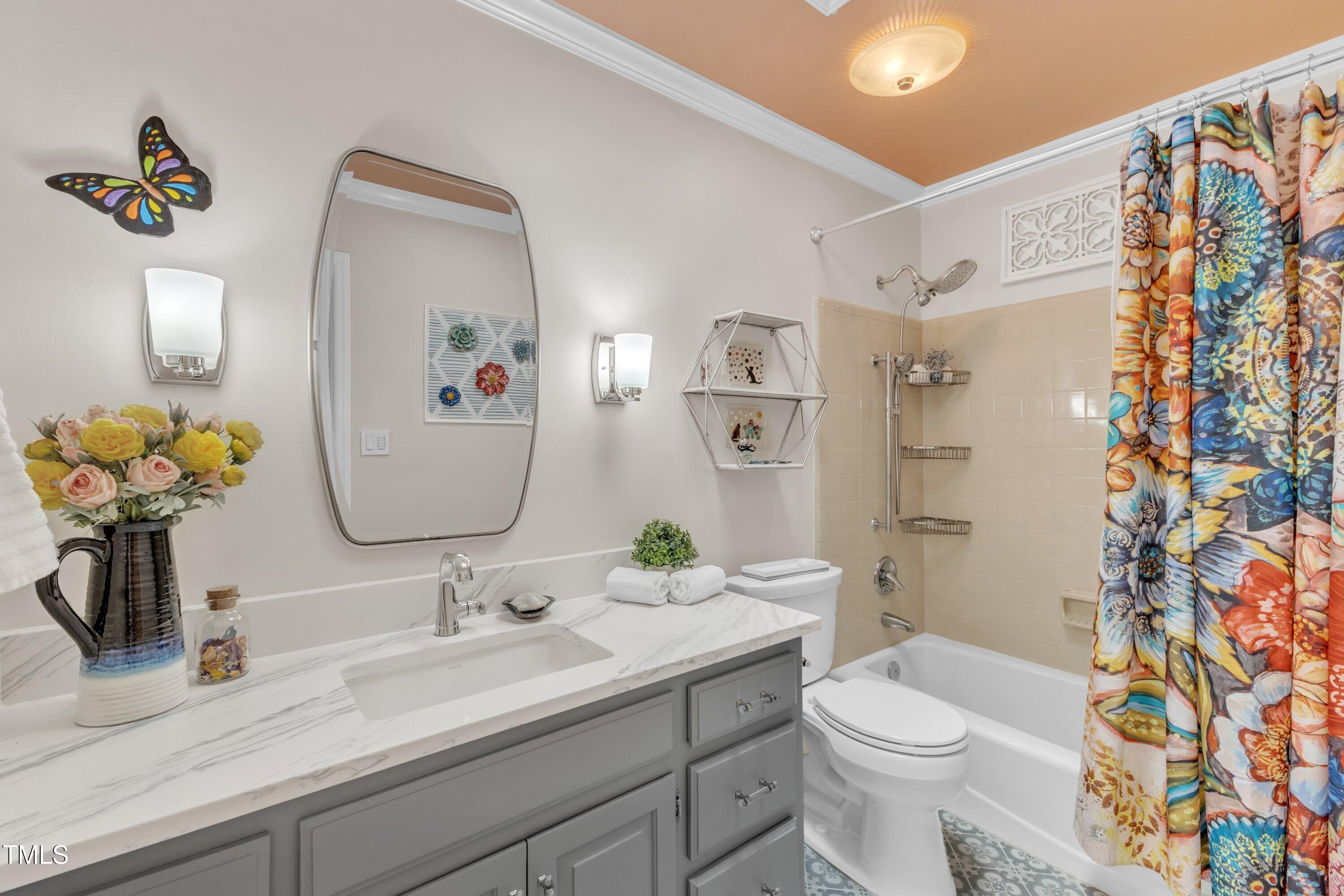 11100 Honeycutt Road Raleigh, NC 27614 - Photo 23 of 37 a bathroom with a toilet sink and mirror