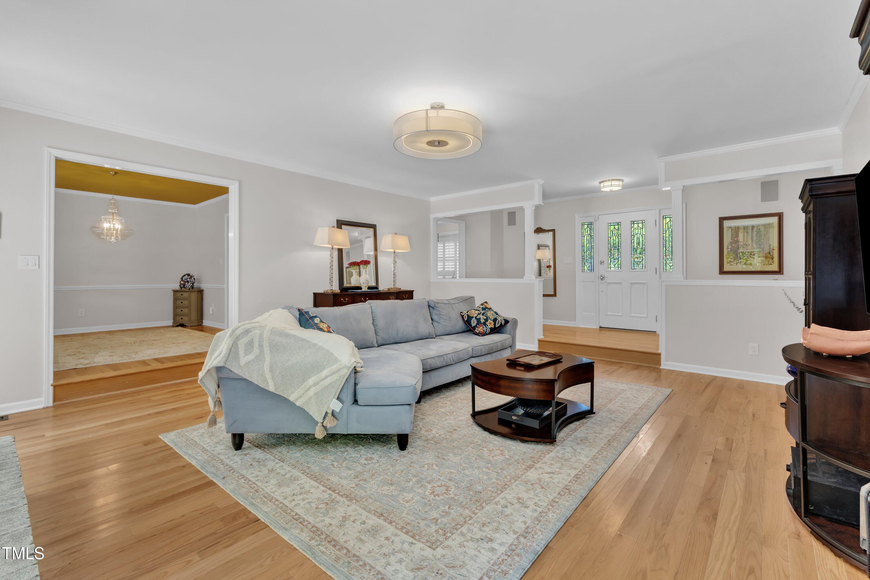 11100 Honeycutt Road Raleigh, NC 27614 - Photo 26 of 37 a living room with furniture and a wooden floor
