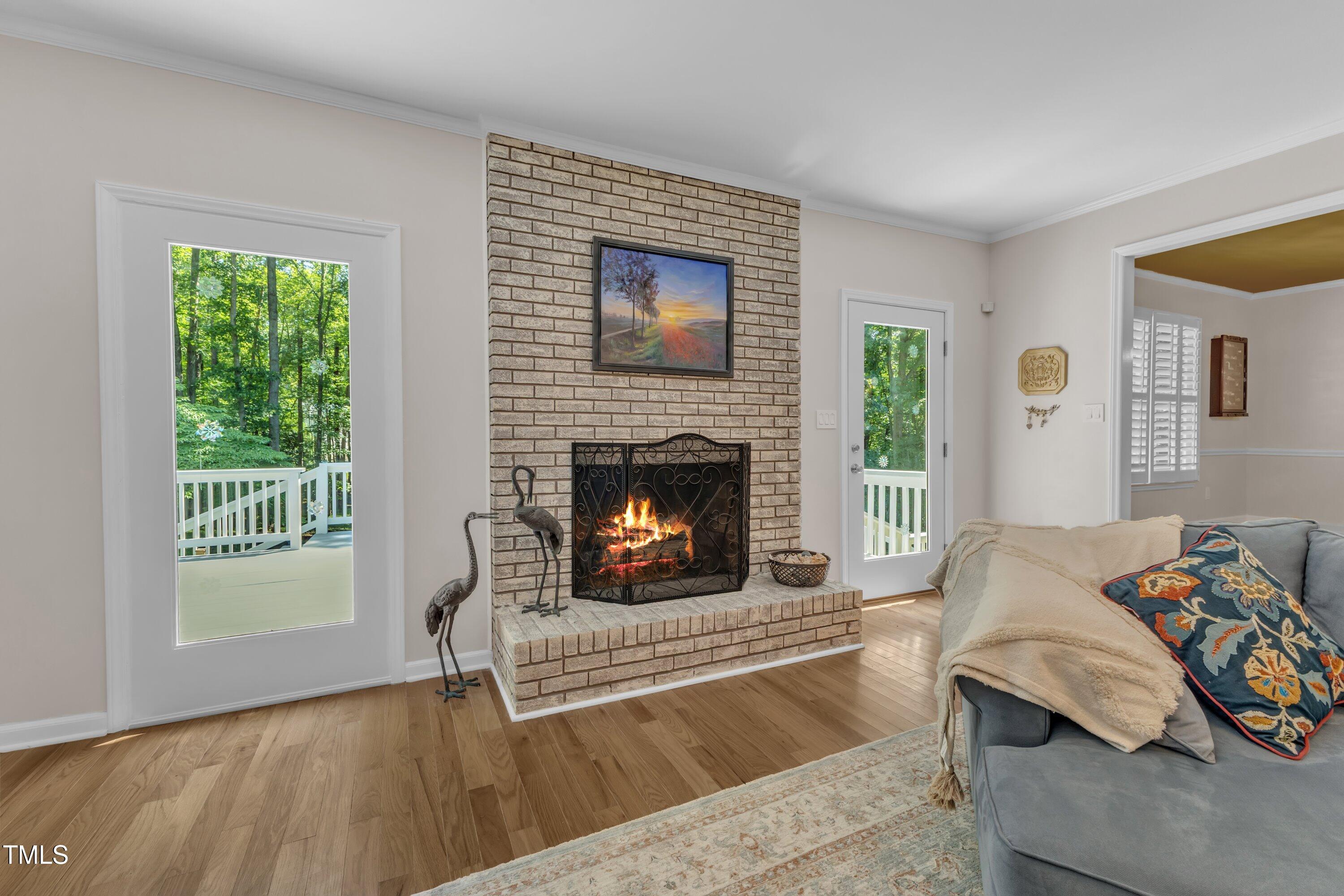11100 Honeycutt Road Raleigh, NC 27614 - Photo 28 of 37 a living room with furniture and a fireplace