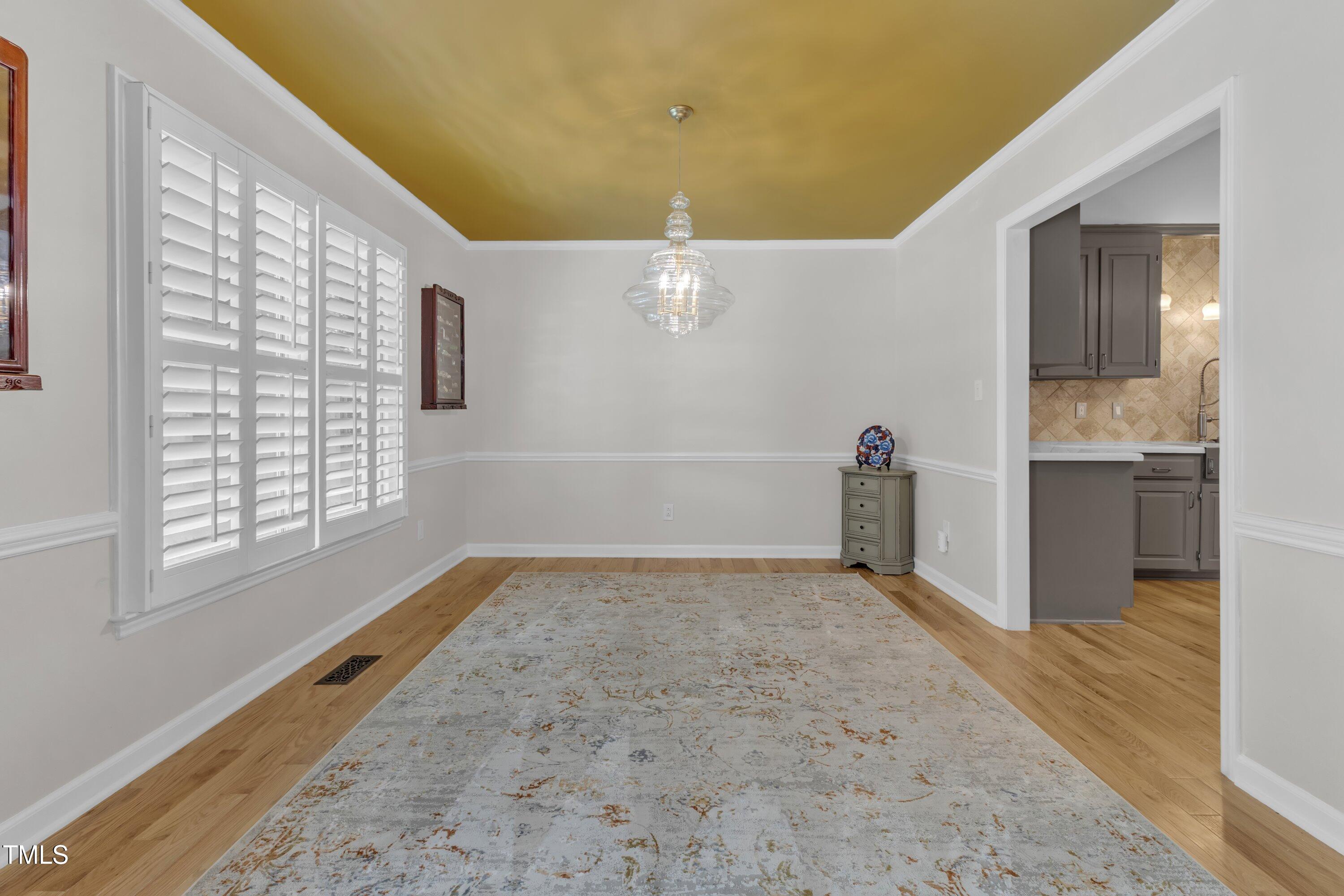 11100 Honeycutt Road Raleigh, NC 27614 - Photo 29 of 37 a view of an empty room with a window