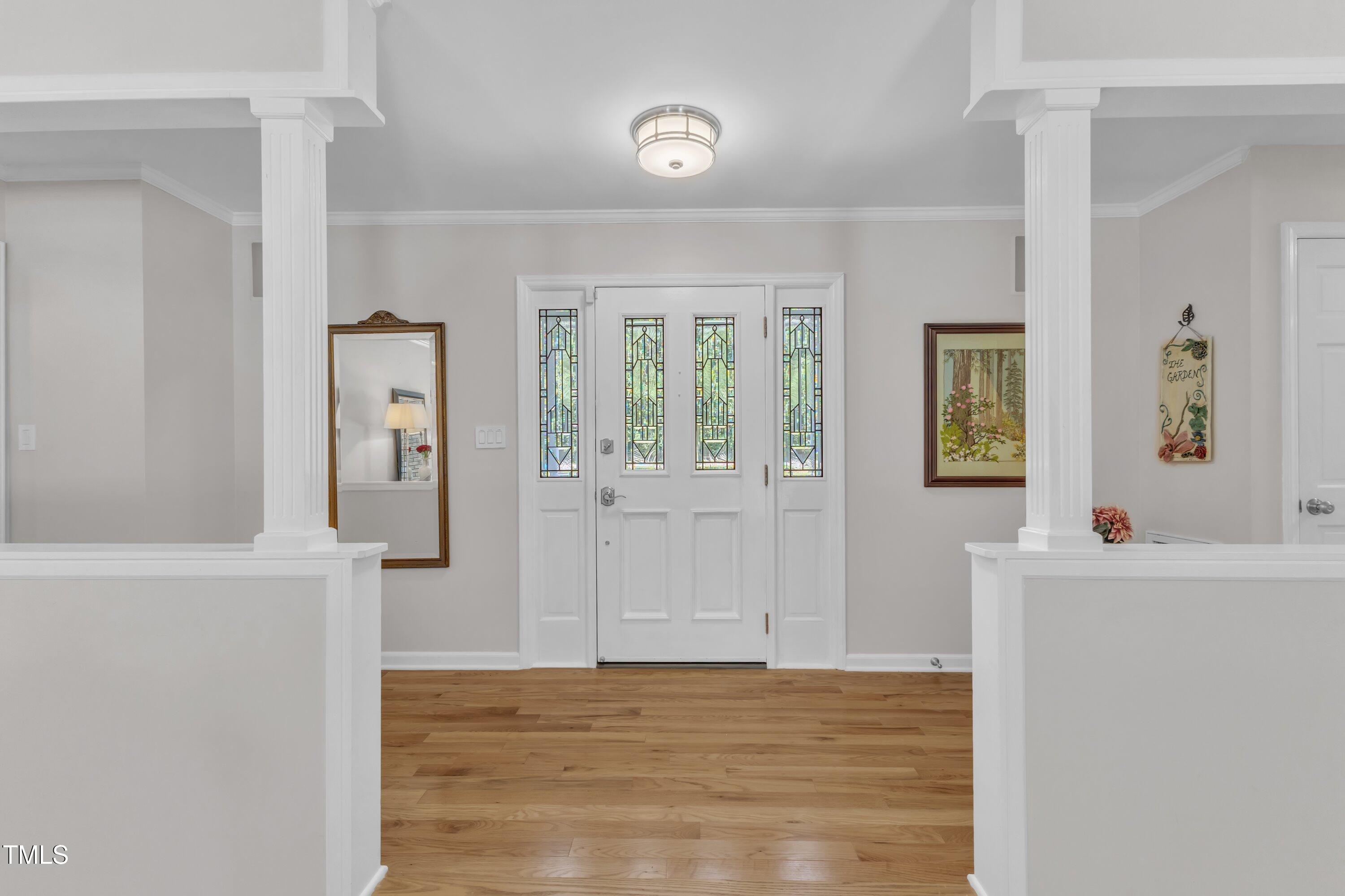 11100 Honeycutt Road Raleigh, NC 27614 - Photo 3 of 37 a view of an entryway with wooden floor
