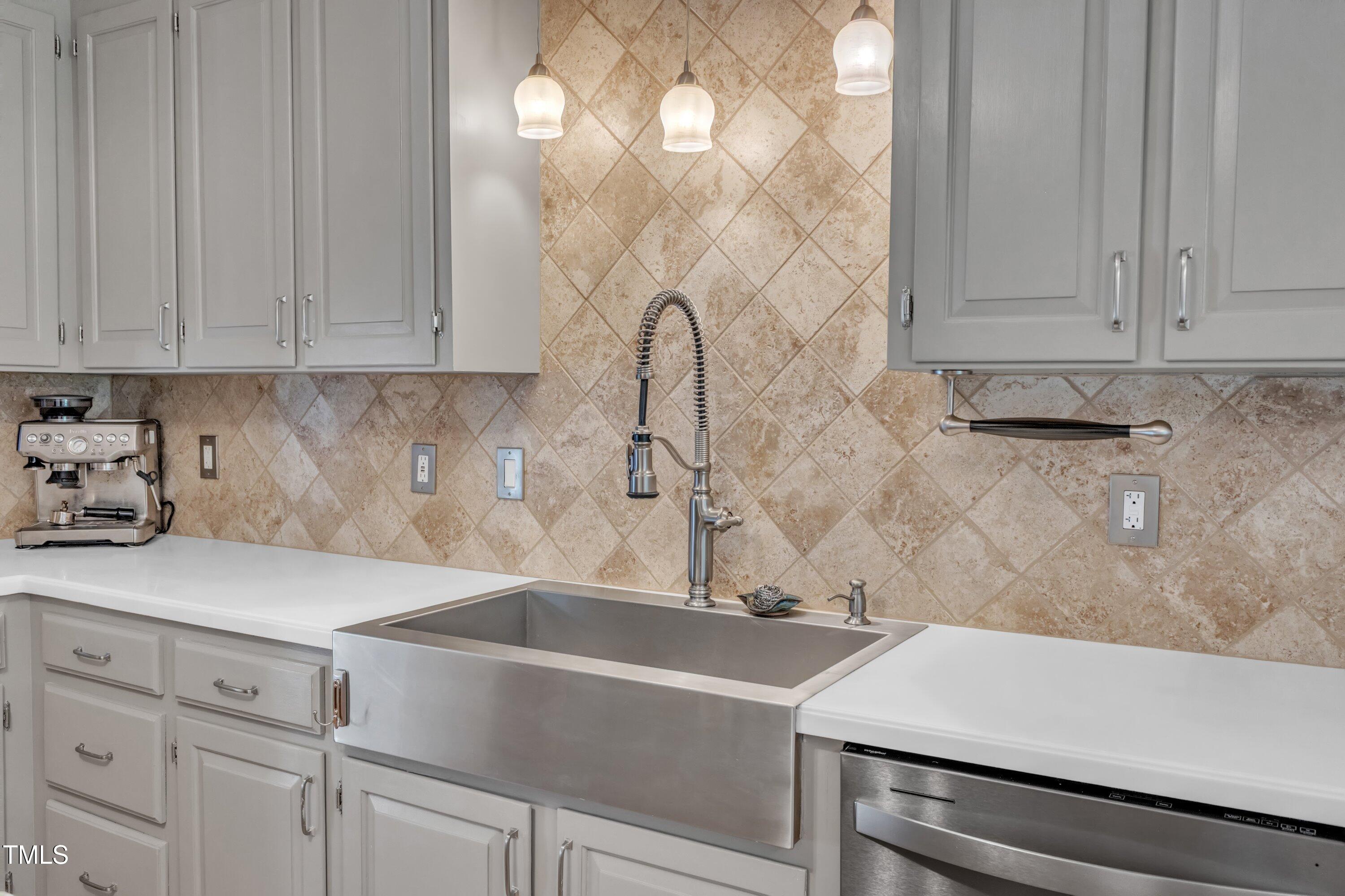 11100 Honeycutt Road Raleigh, NC 27614 - Photo 7 of 37 a kitchen with a sink and cabinets