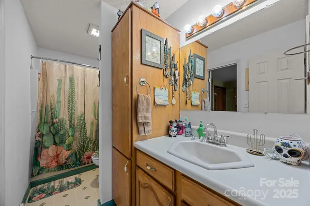 a bathroom with a sink double vanity and a mirror