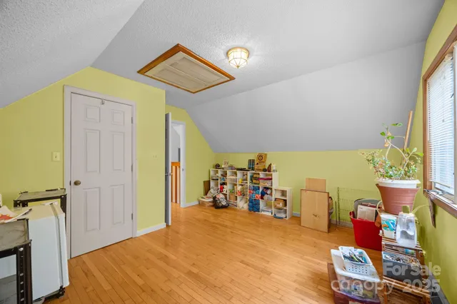 a bed room with a bed and a window