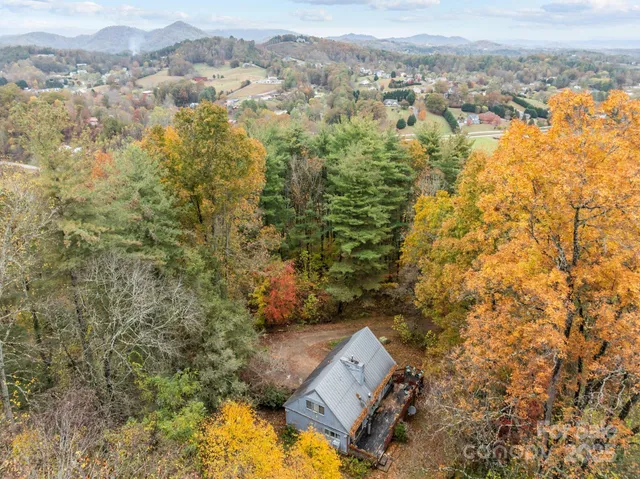 an aerial view of houses with yard