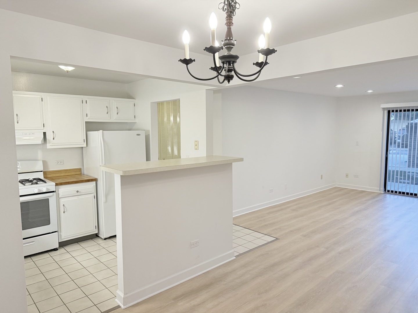 3531 East Central Road, Unit 101 Des Plaines, IL 60025 - Photo 4 of 15 a view of a kitchen with cabinets and stainless steel appliances