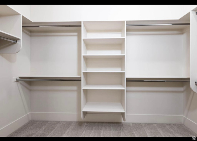 2788 East Rill Drive Washington, UT 84780 - Photo 25 of 41 Custom closet system featuring multiple hanging rods and integrated shelving units