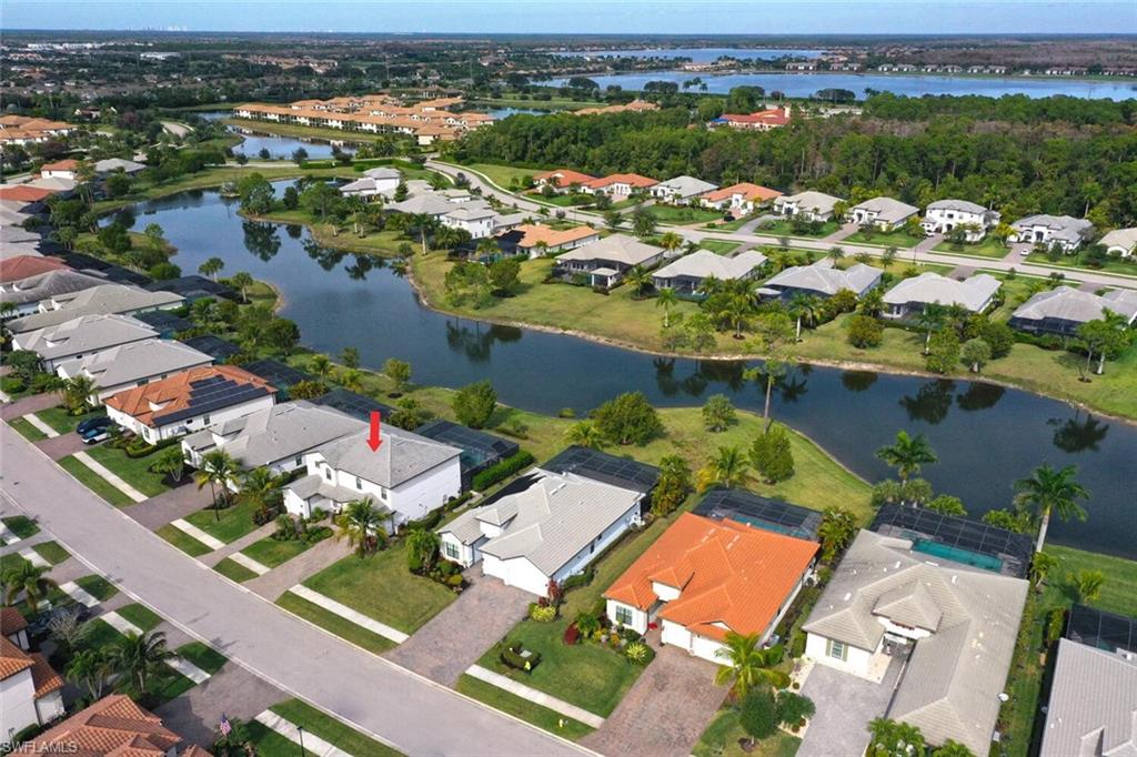 2115 Antigua Lane Naples, FL 34120 - Photo 2 of 41 Aerial perspective of suburban area with a nearby body of water