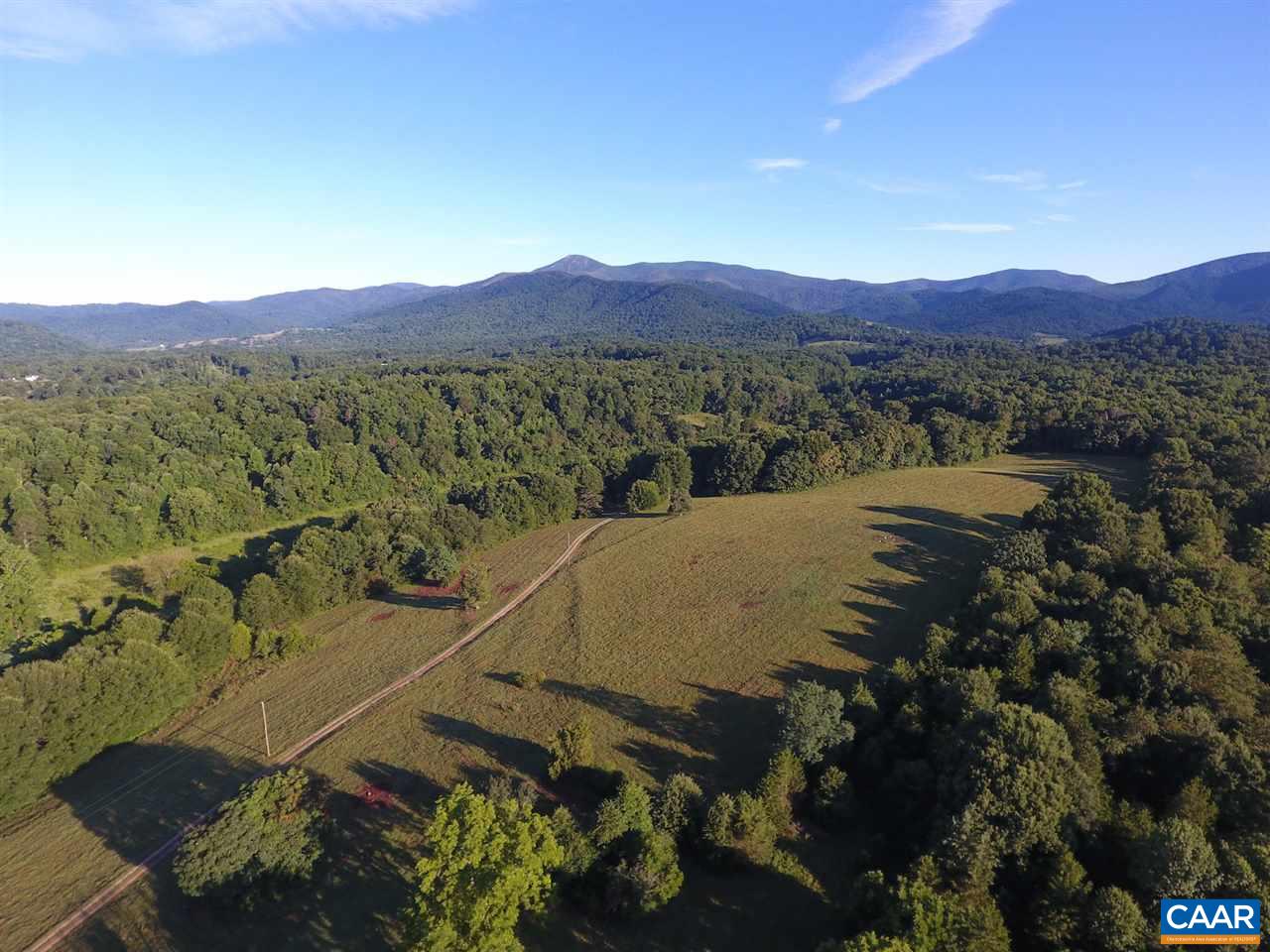 186 Foothills Trail Amherst, VA 24521 - Photo 20 of 23 a view of a lush green field with mountains in the background