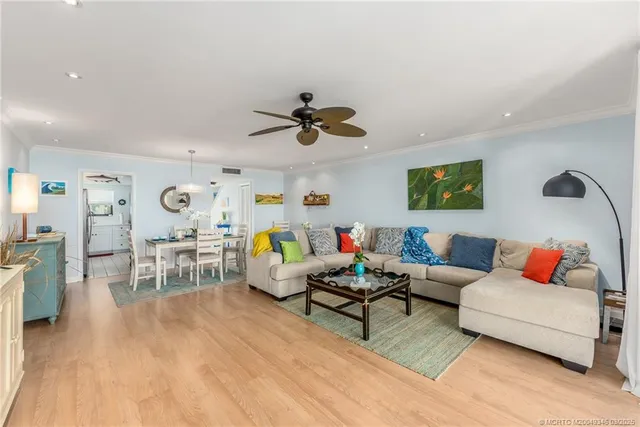 a kitchen with stainless steel appliances white cabinets a stove top oven a sink and dishwasher