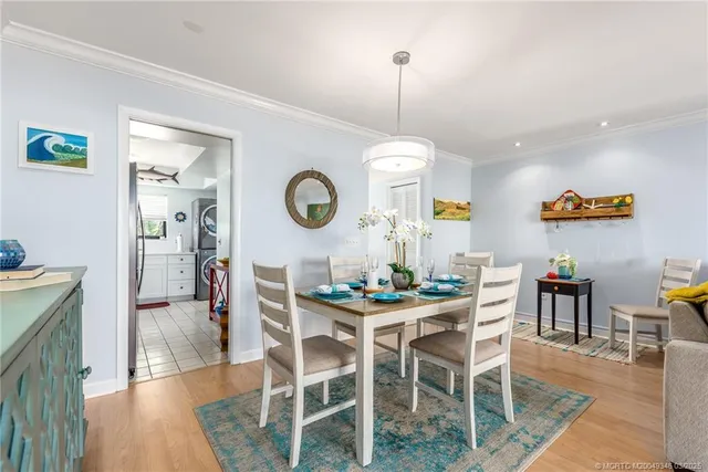 a utility room with sink dryer and washer