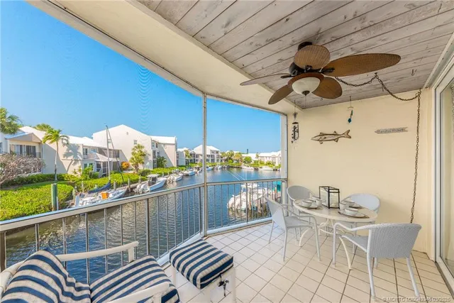 a bathroom with a granite countertop sink mirror vanity and toilet