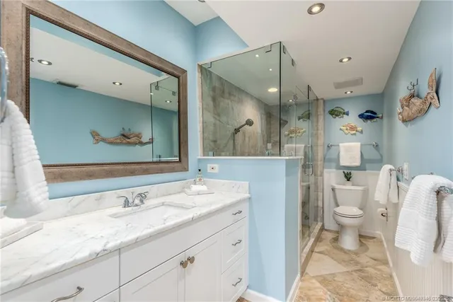 a view of a house with a big yard and large trees