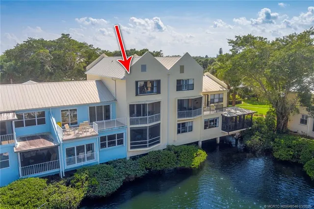 a view of a lake with outdoor seating space