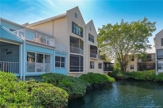 a view of a hallway with wooden floor and entryway