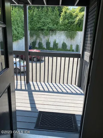 a view of a balcony with chairs