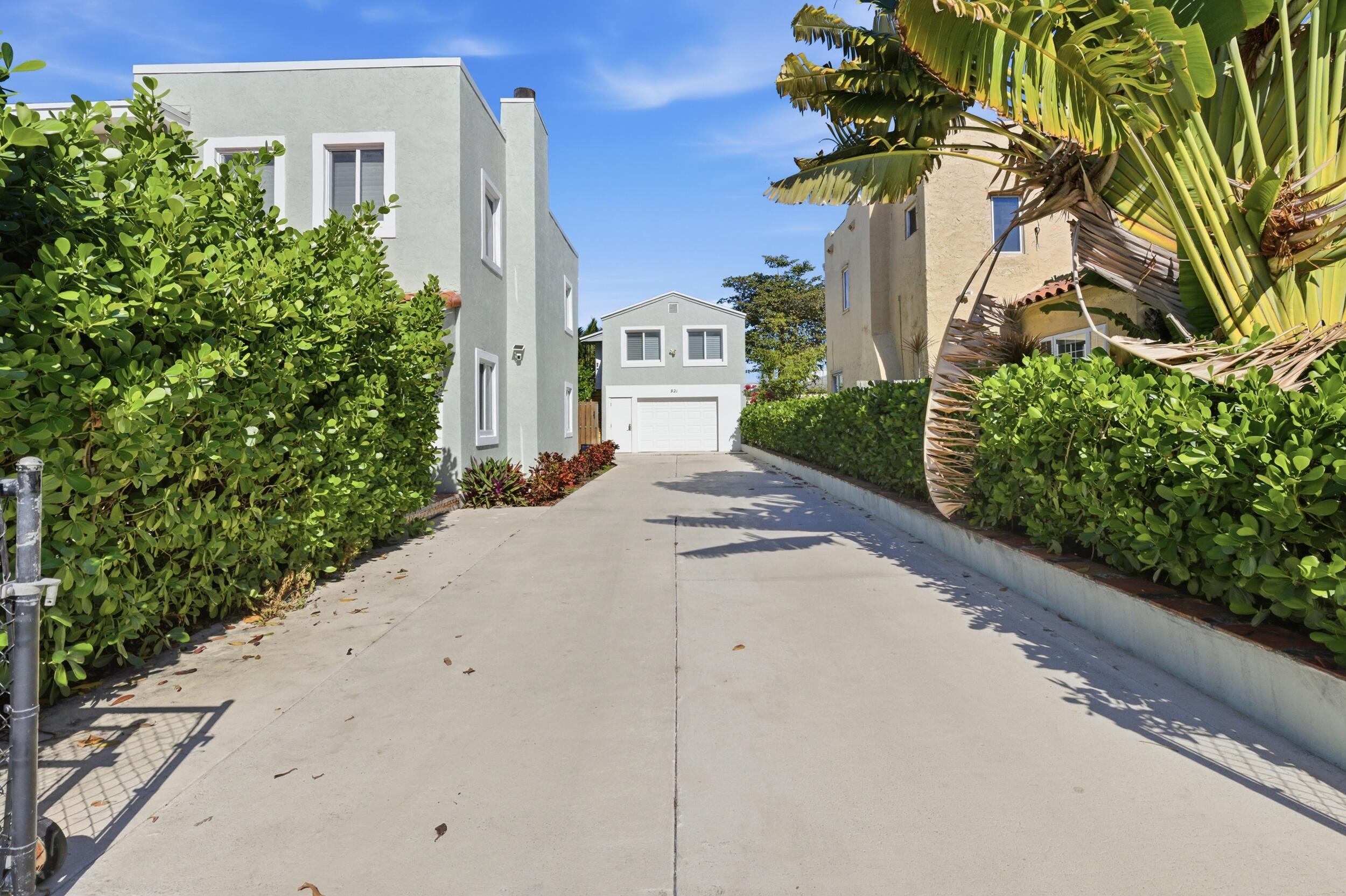 921 Ortega Road West Palm Beach, FL 33405 - Photo 57 of 60 a front view of a house with a yard and fountain