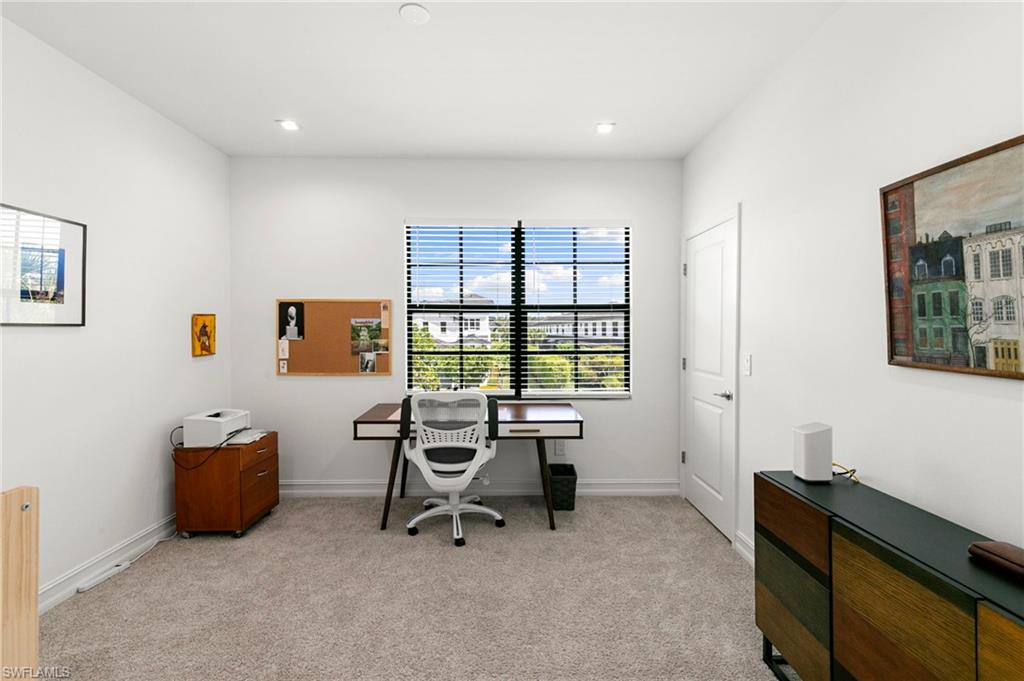 7515 Morgan Way Naples, FL 34119 - Photo 16 of 34 a view of a workspace with furniture and a window