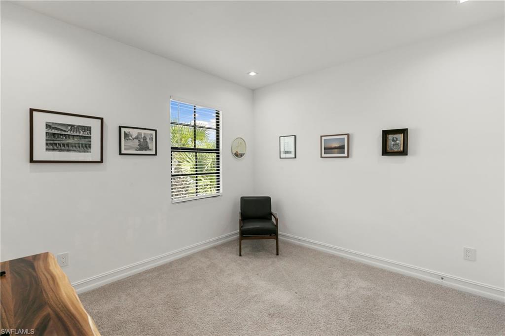 7515 Morgan Way Naples, FL 34119 - Photo 18 of 34 a room with window and a chair