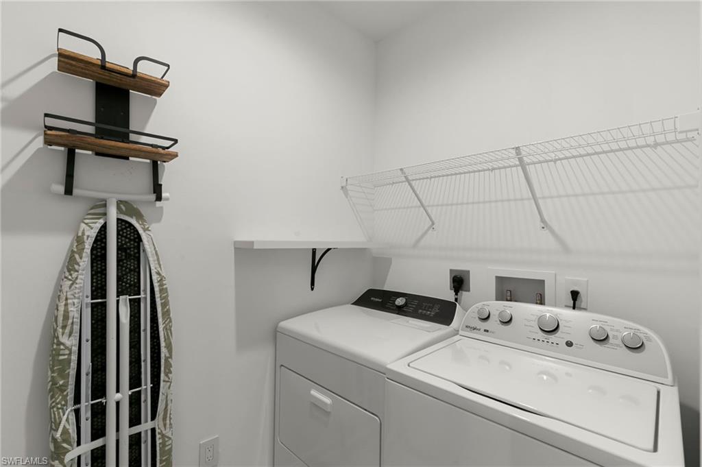 7515 Morgan Way Naples, FL 34119 - Photo 21 of 34 a utility room with dryer and washer