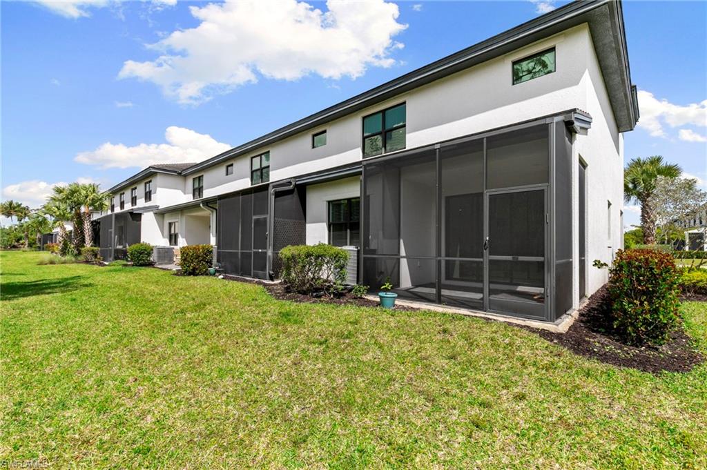 7515 Morgan Way Naples, FL 34119 - Photo 24 of 34 a view of a house with a yard