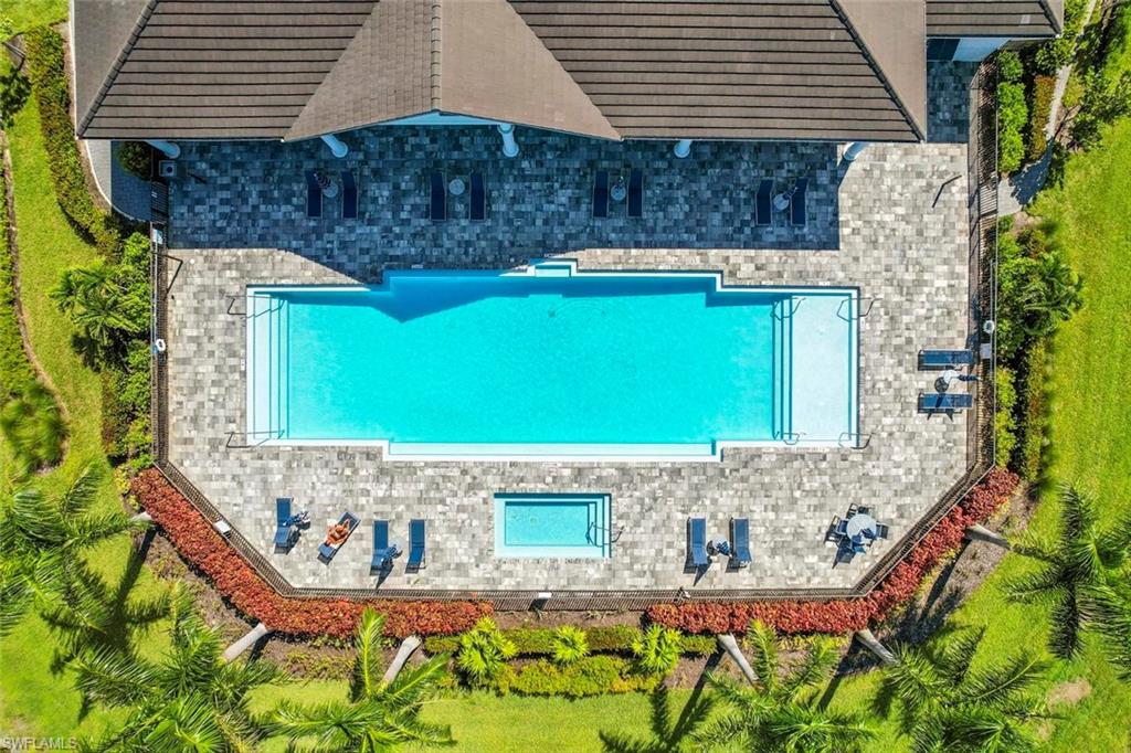 7515 Morgan Way Naples, FL 34119 - Photo 28 of 34 front view of a house with a garden