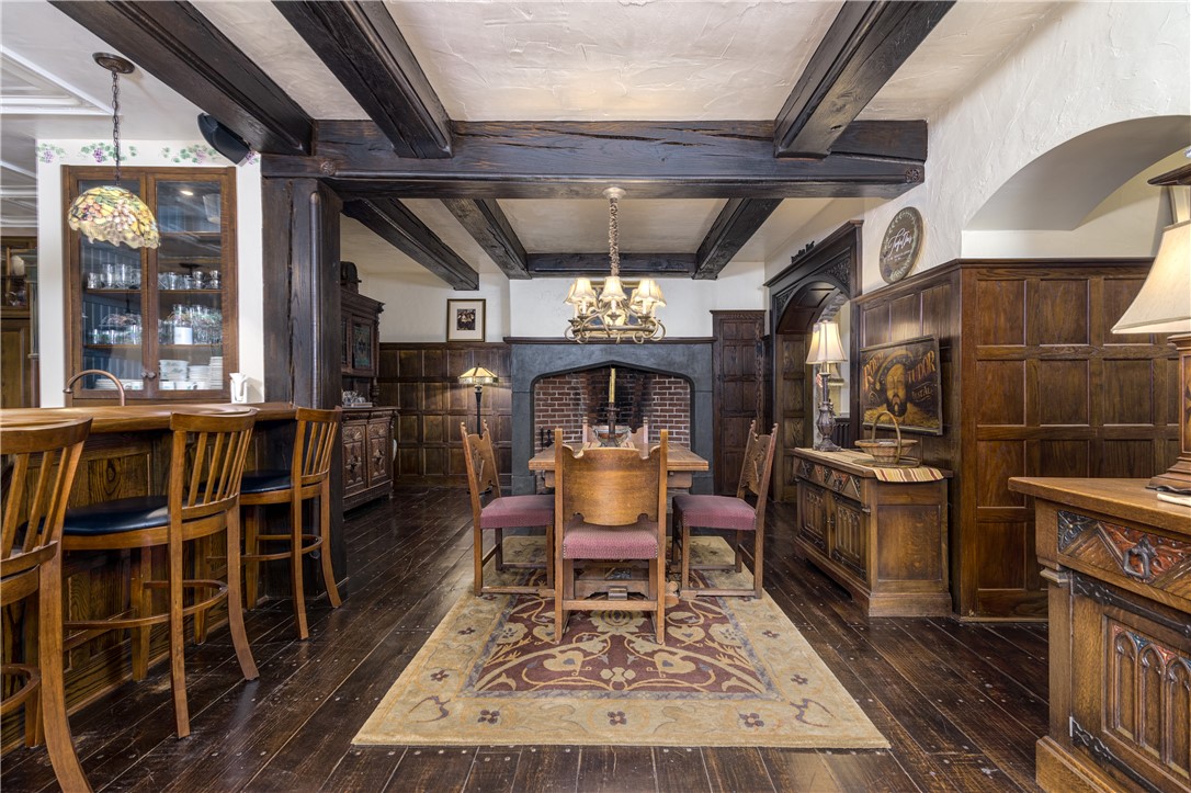 2550 Vineyard Road North Kingstown, RI 02874 - Photo 15 of 50 Gathering room off the kitchen and dining room has oak paneled walls and brick fireplace. This room has radiant heat in the floors
