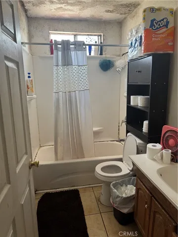 a kitchen with a sink a stove and a shower