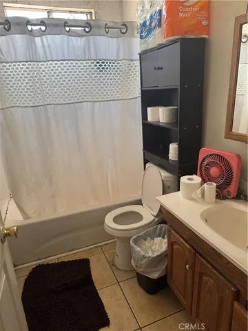 a bathroom with a granite countertop shower