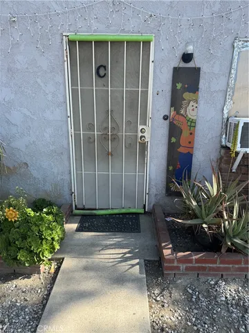a bed sitting in a room next to a window