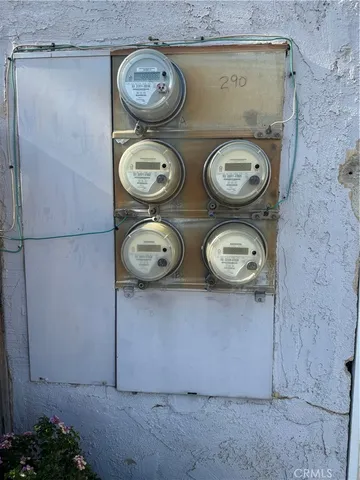 a view of a patio with chairs and a fire pit