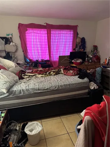 a bedroom with a bed and a cabinets