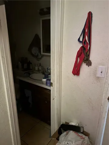 a view of walk in closet with clothes