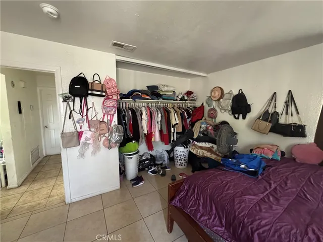 a outdoor dining space with furniture and a chandelier