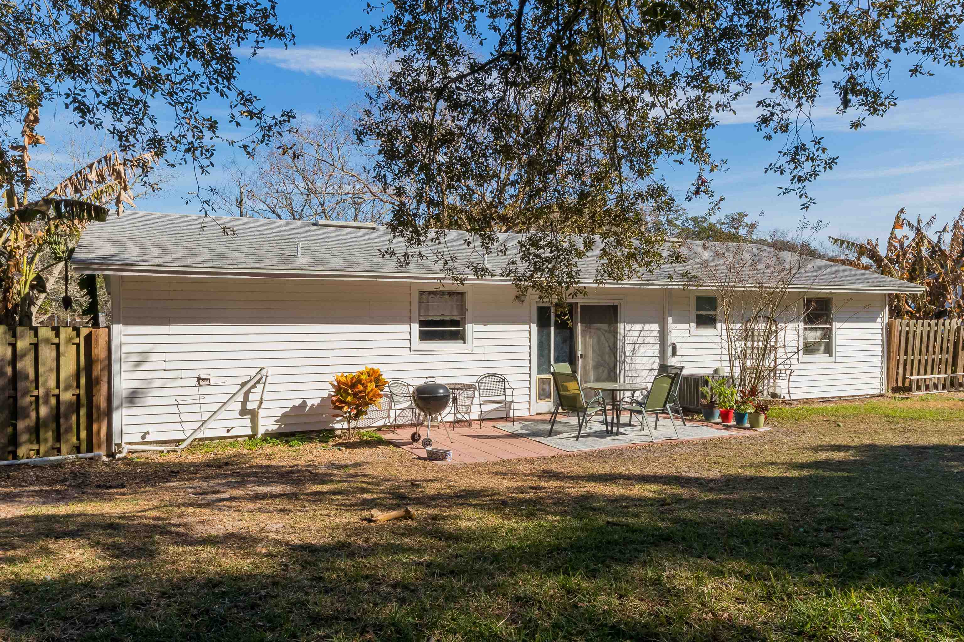 802 Royal Road St. Augustine, FL 32086 - Photo 16 of 47 a backyard of a house with outdoor seating