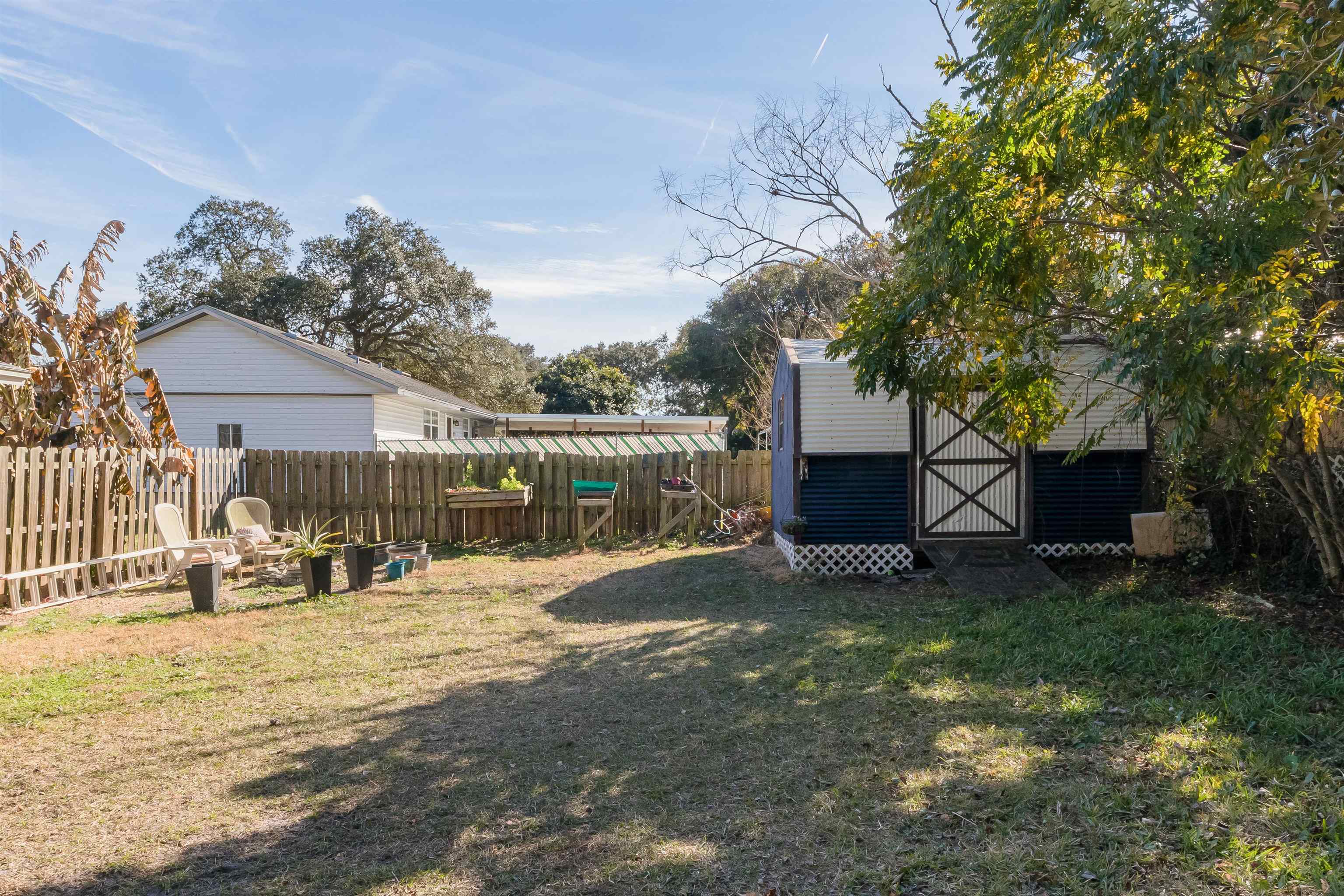 802 Royal Road St. Augustine, FL 32086 - Photo 17 of 47 a view of backyard with barbeque grill and wooden fence