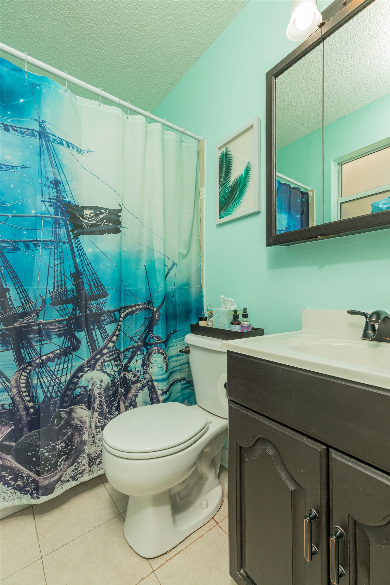 802 Royal Road St. Augustine, FL 32086 - Photo 19 of 47 a bathroom with a toilet sink and mirror