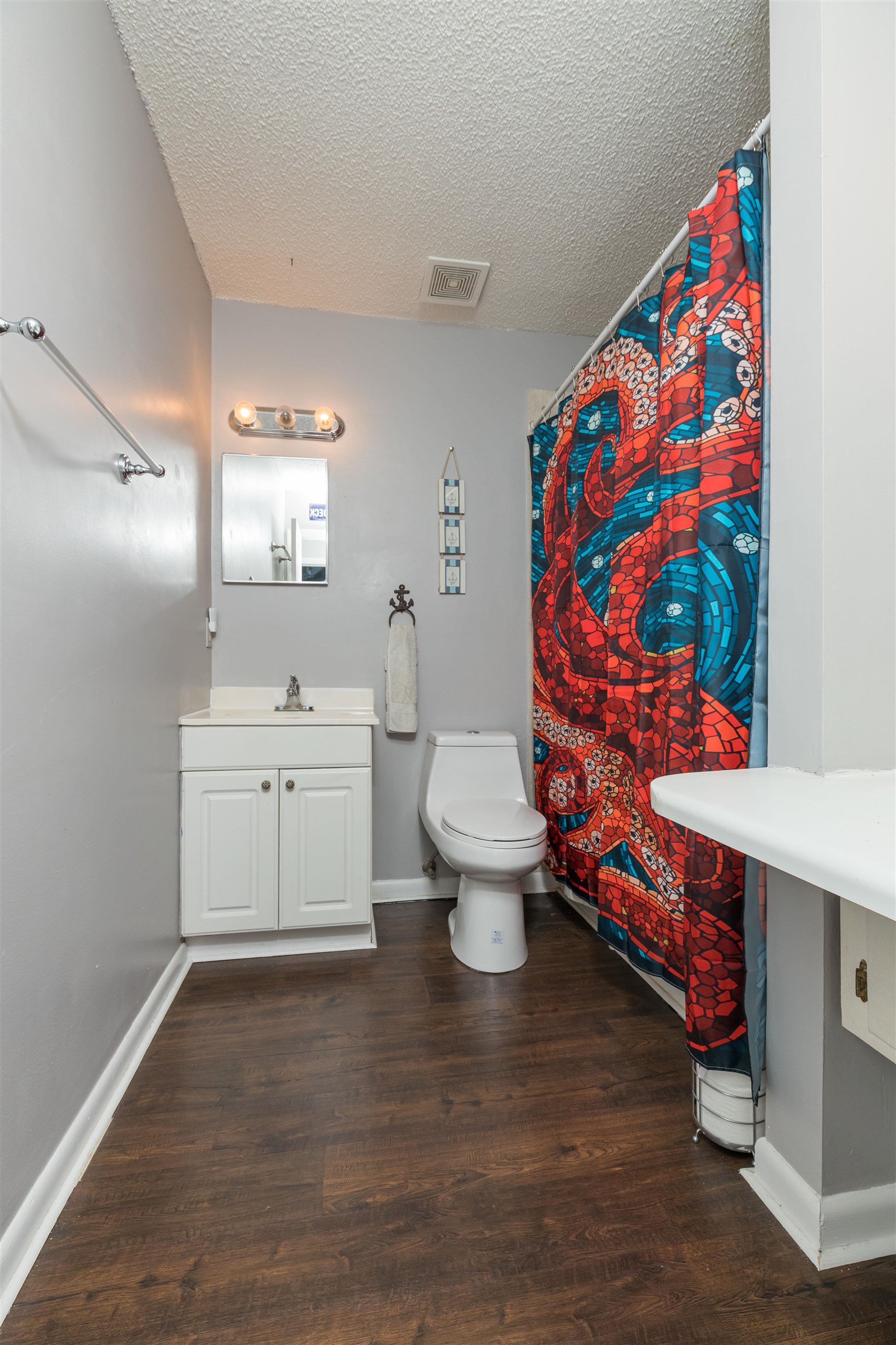 802 Royal Road St. Augustine, FL 32086 - Photo 23 of 47 a bathroom with a sink mirror vanity and toilet